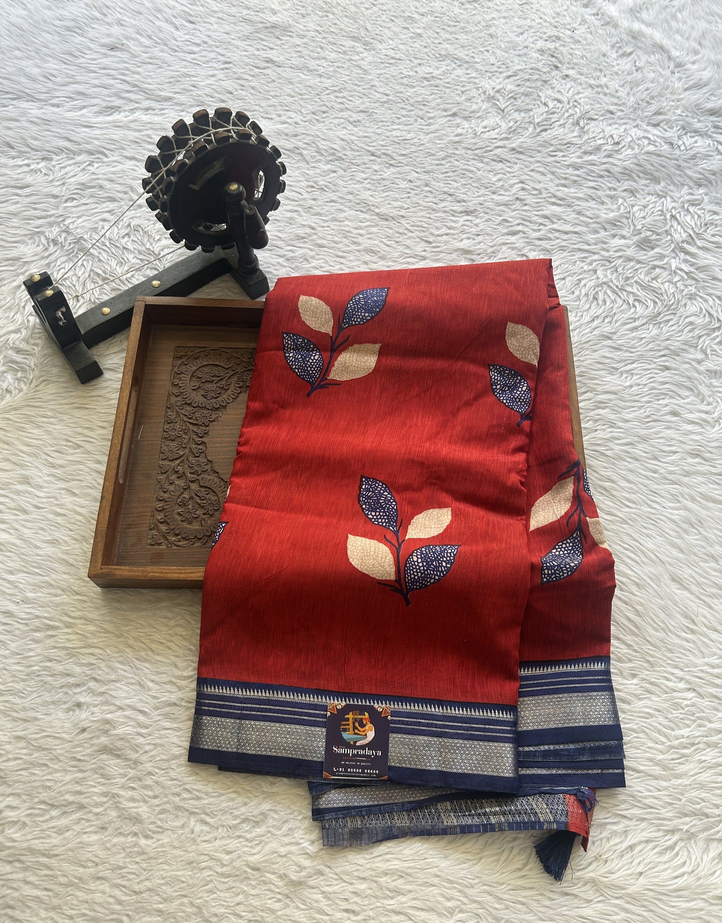 Dola Crepe Saree Red Colored Complemented with a Ink Blue Zari Border. - Sampradaya Designer Studio
