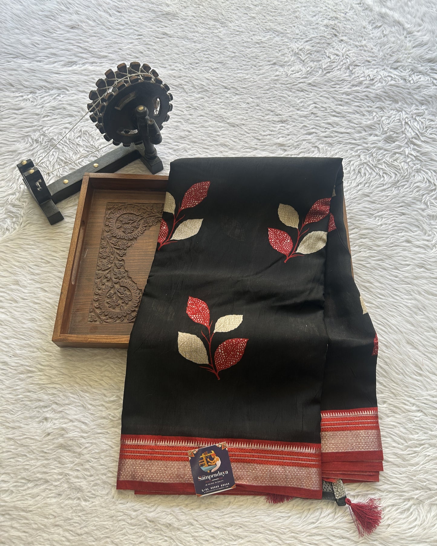 Dola Crepe Saree Black Colored Complemented with a Red Zari Border. - Sampradaya Designer Studio