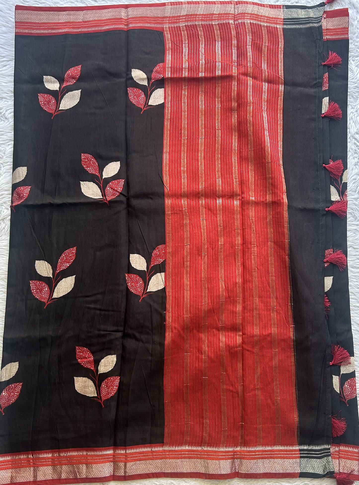 Dola Crepe Saree Black Colored Complemented with a Red Zari Border. - Sampradaya Designer Studio