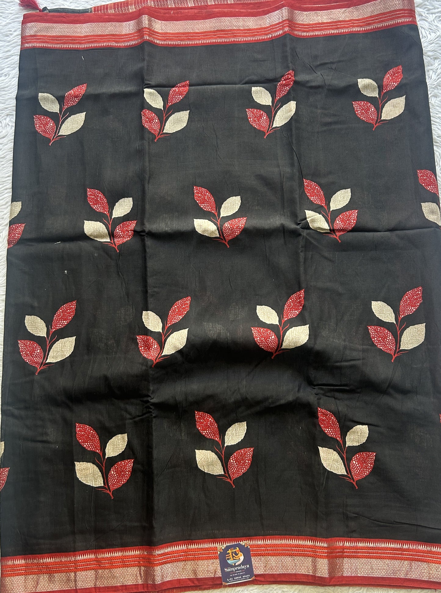Dola Crepe Saree Black Colored Complemented with a Red Zari Border. - Sampradaya Designer Studio