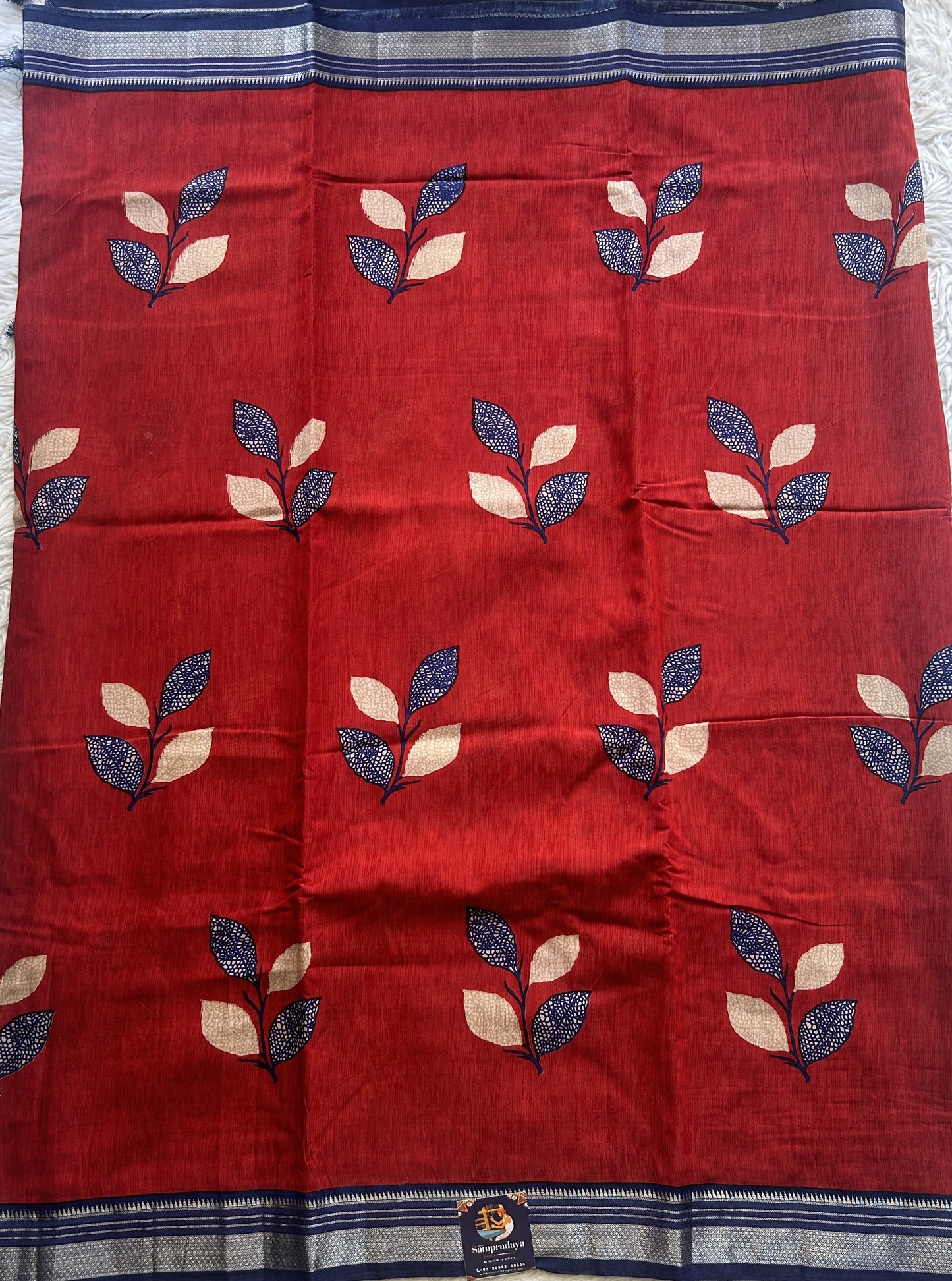 Dola Crepe Saree Red Colored Complemented with a Ink Blue Zari Border. - Sampradaya Designer Studio