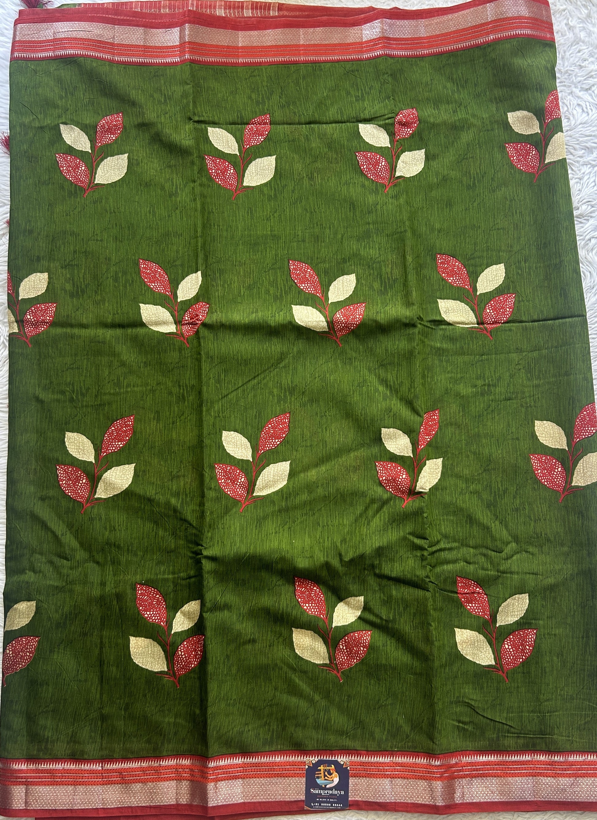 Dola Crepe Saree Leaf Green Colored Complemented with a Zari Border. - Sampradaya Designer Studio
