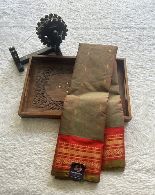 Gadwal Sico Saree Olive Green colored complemented with a Red Zari Border. - Sampradaya Designer Studio