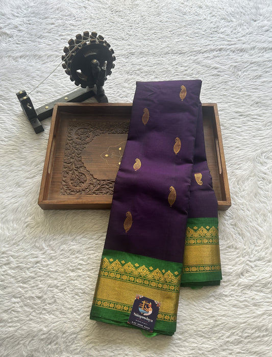 Gadwal Sico Saree Brinjal colored complemented with a Green Zari Border. - Sampradaya Designer Studio