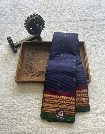 Gadwal Sico Saree Navy Blue colored complemented with a Purple Zari Border. - Sampradaya Designer Studio