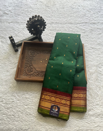 Gadwal Sico Saree Dark Green colored complemented with a Maroon Zari Border. - Sampradaya Designer Studio