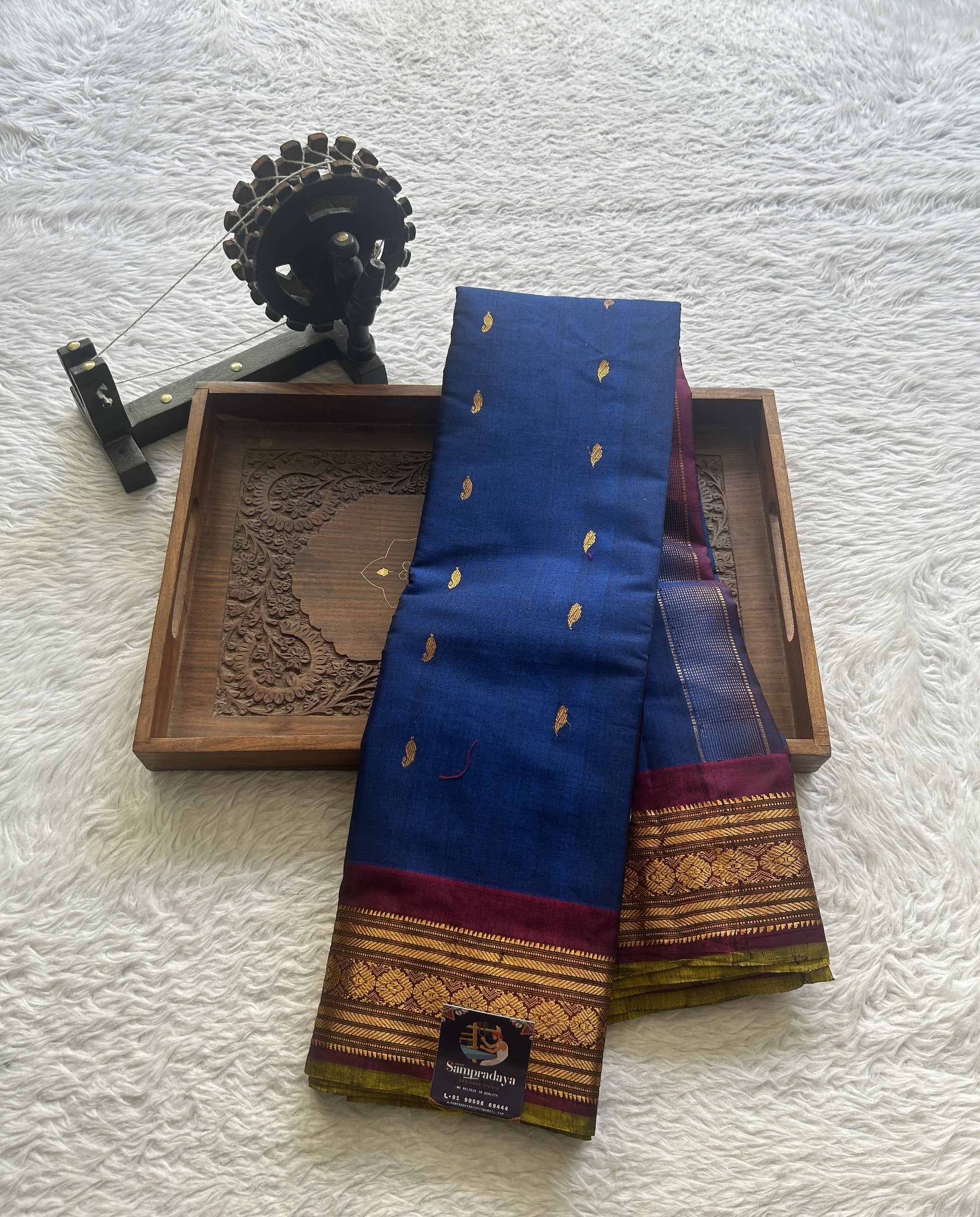 Gadwal Sico Saree Ink Blue colored complemented with a Purple Zari Border. - Sampradaya Designer Studio