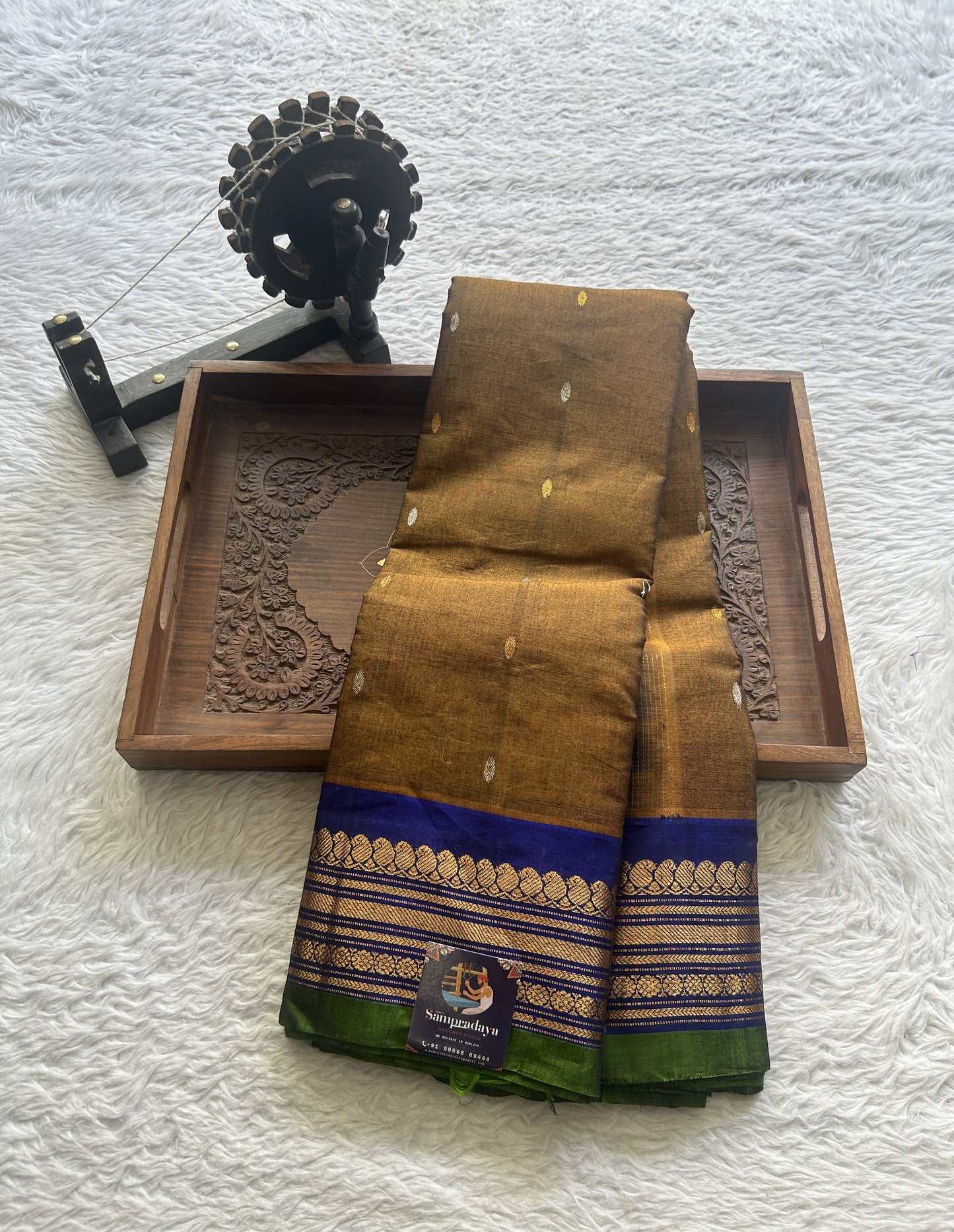 Gadwal Sico Saree Brown colored complemented with a Blue Zari Border. - Sampradaya Designer Studio