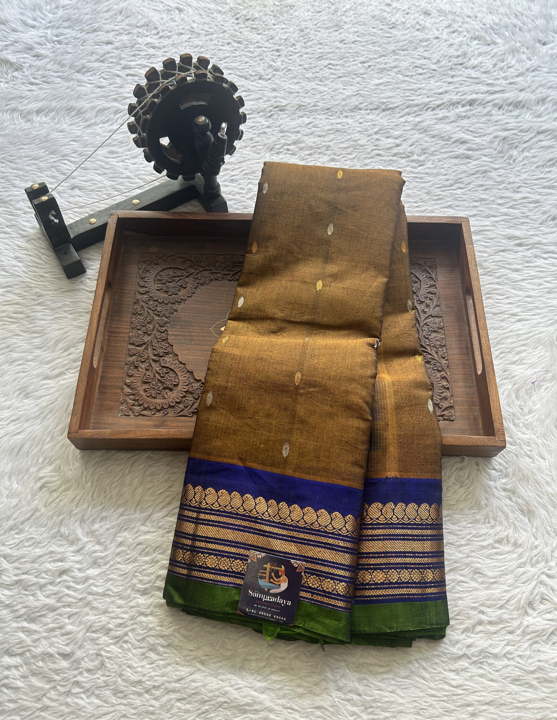 Gadwal Sico Saree Brown colored complemented with a Blue Zari Border. - Sampradaya Designer Studio