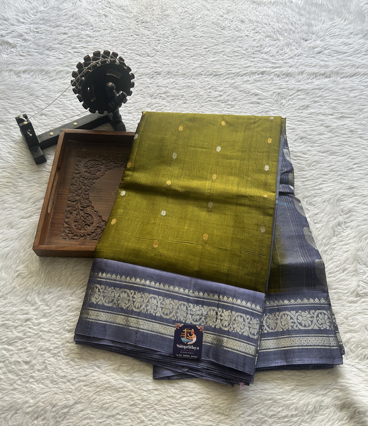 Gadwal Sico Saree Green colored complemented with a Lilac Zari Border. - Sampradaya Designer Studio