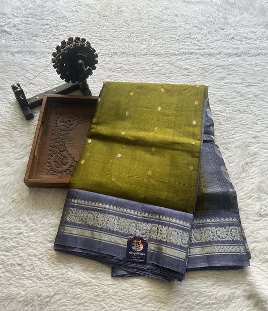 Gadwal Sico Saree Green colored complemented with a Lilac Zari Border. - Sampradaya Designer Studio
