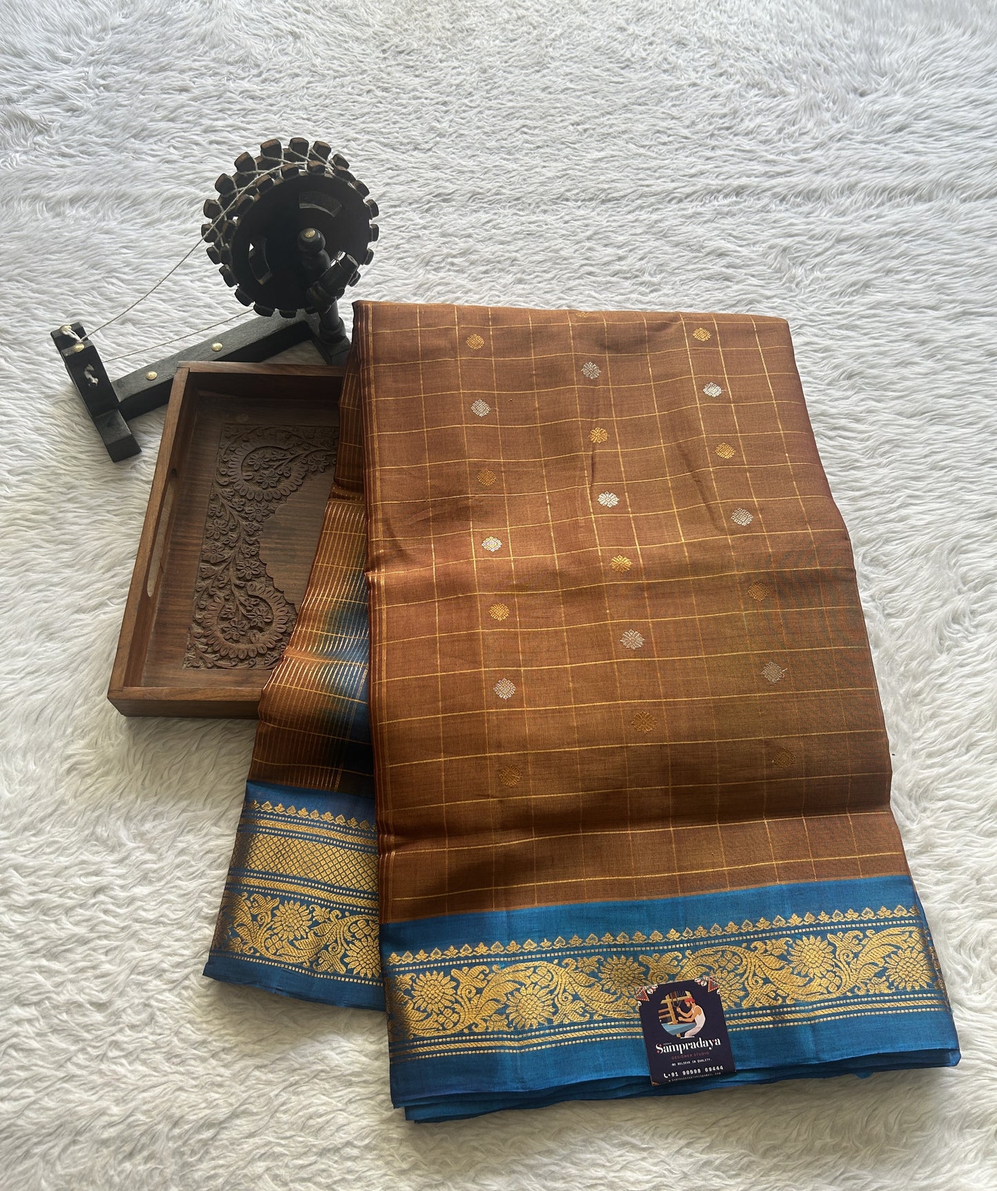 Gadwal Sico Saree Light Brown colored complemented with a Blue Zari Border. - Sampradaya Designer Studio