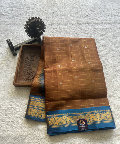 Gadwal Sico Saree Light Brown colored complemented with a Blue Zari Border. - Sampradaya Designer Studio