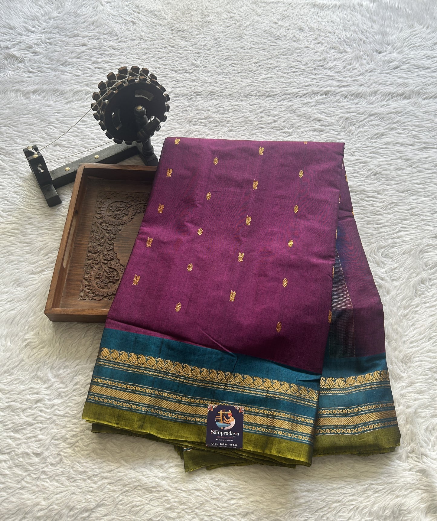 Gadwal Sico Saree Dark Purple colored complemented with a Blue Zari Border. - Sampradaya Designer Studio