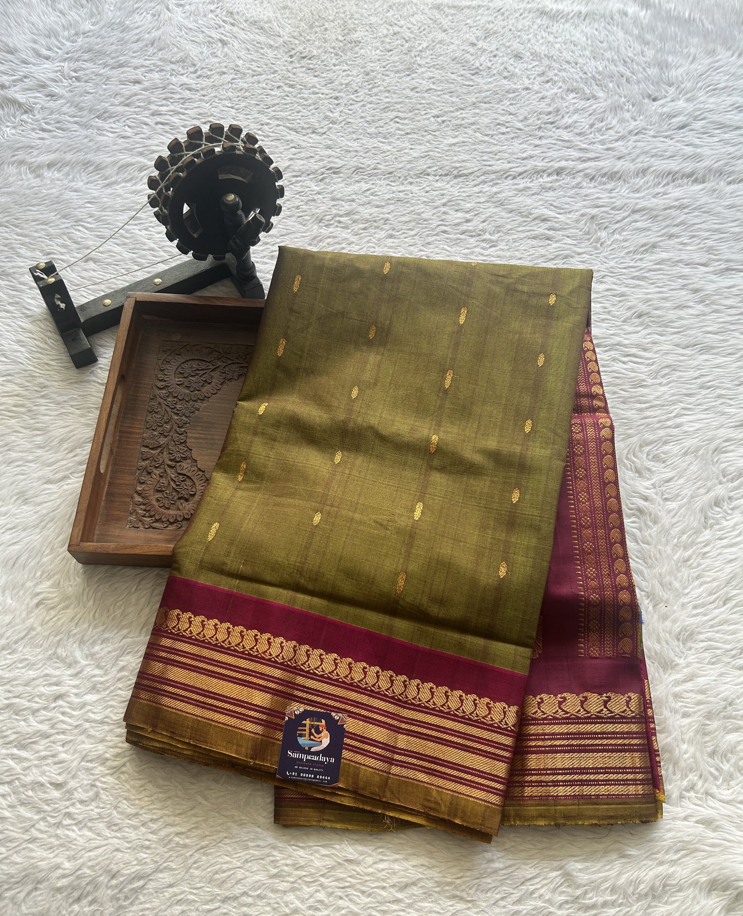 Gadwal Sico Saree Olive Green colored complemented with a Pink Zari Border. - Sampradaya Designer Studio