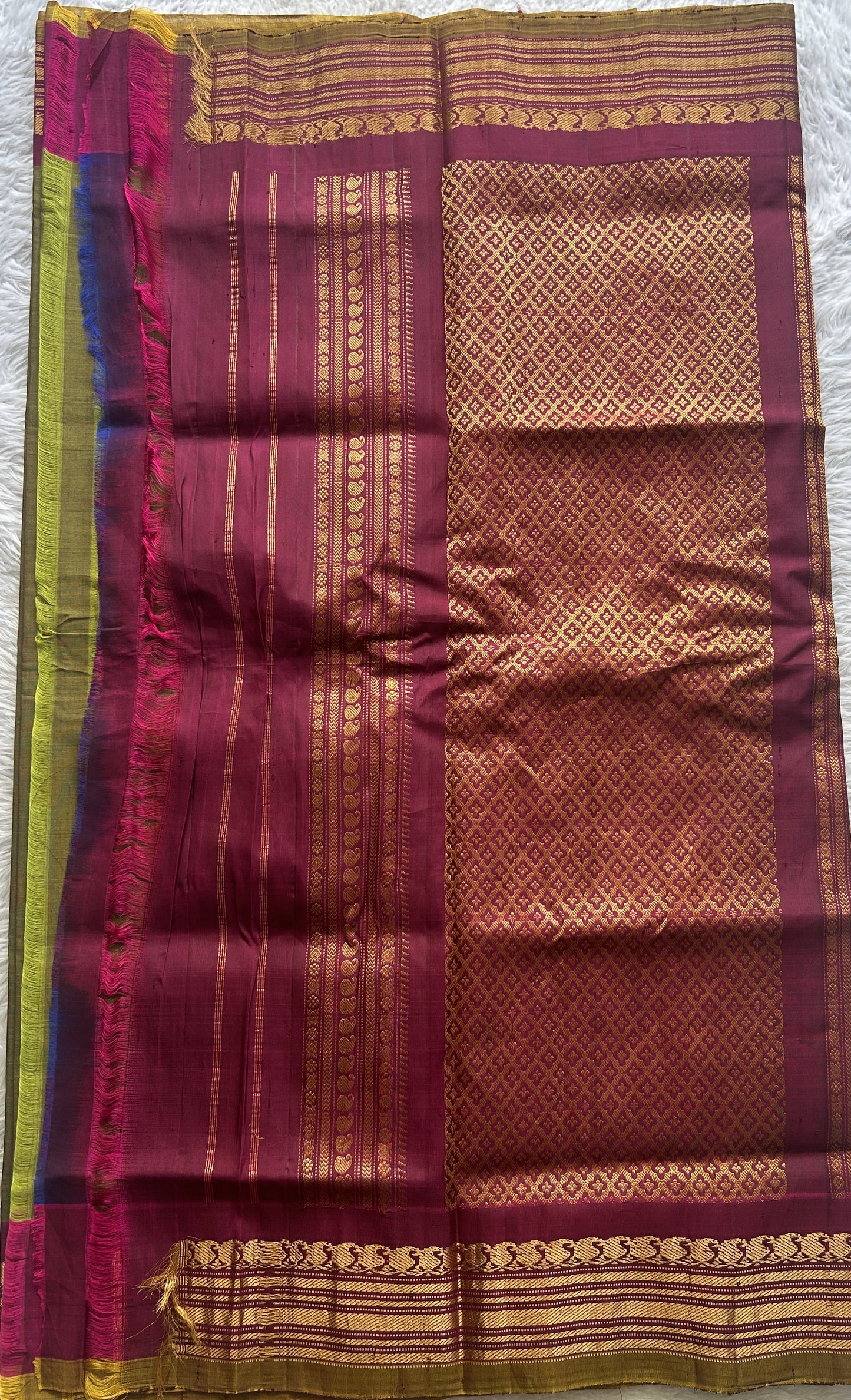 Gadwal Sico Saree Olive Green colored complemented with a Pink Zari Border. - Sampradaya Designer Studio