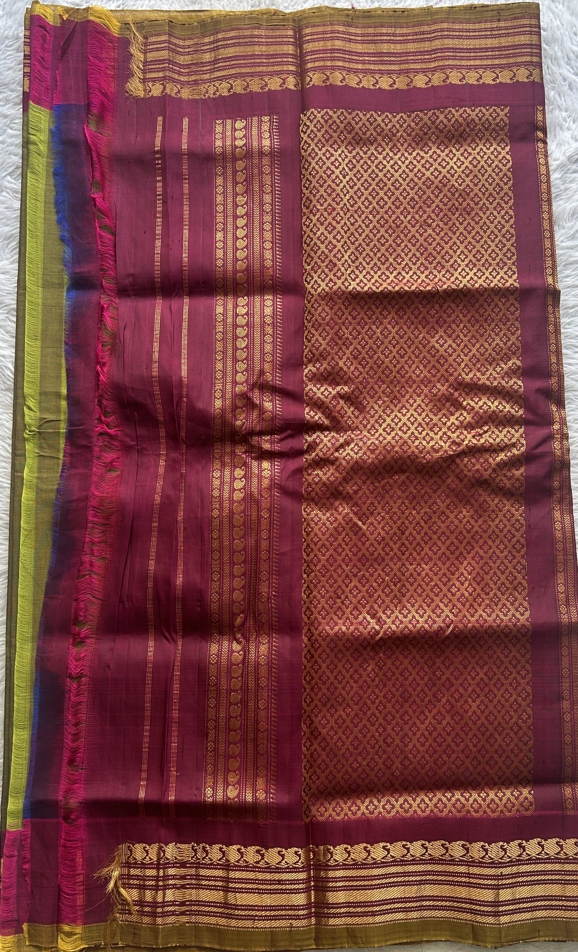 Gadwal Sico Saree Olive Green colored complemented with a Pink Zari Border. - Sampradaya Designer Studio