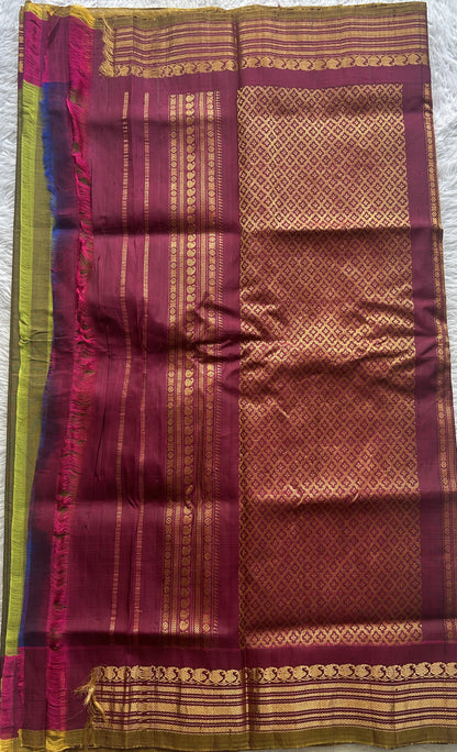 Gadwal Sico Saree Olive Green colored complemented with a Pink Zari Border. - Sampradaya Designer Studio