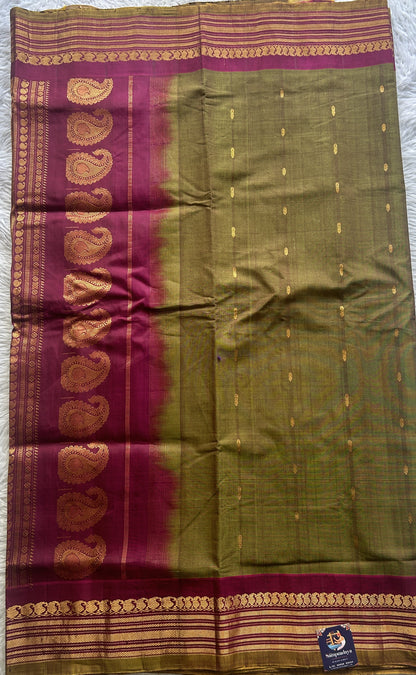 Gadwal Sico Saree Olive Green colored complemented with a Pink Zari Border. - Sampradaya Designer Studio