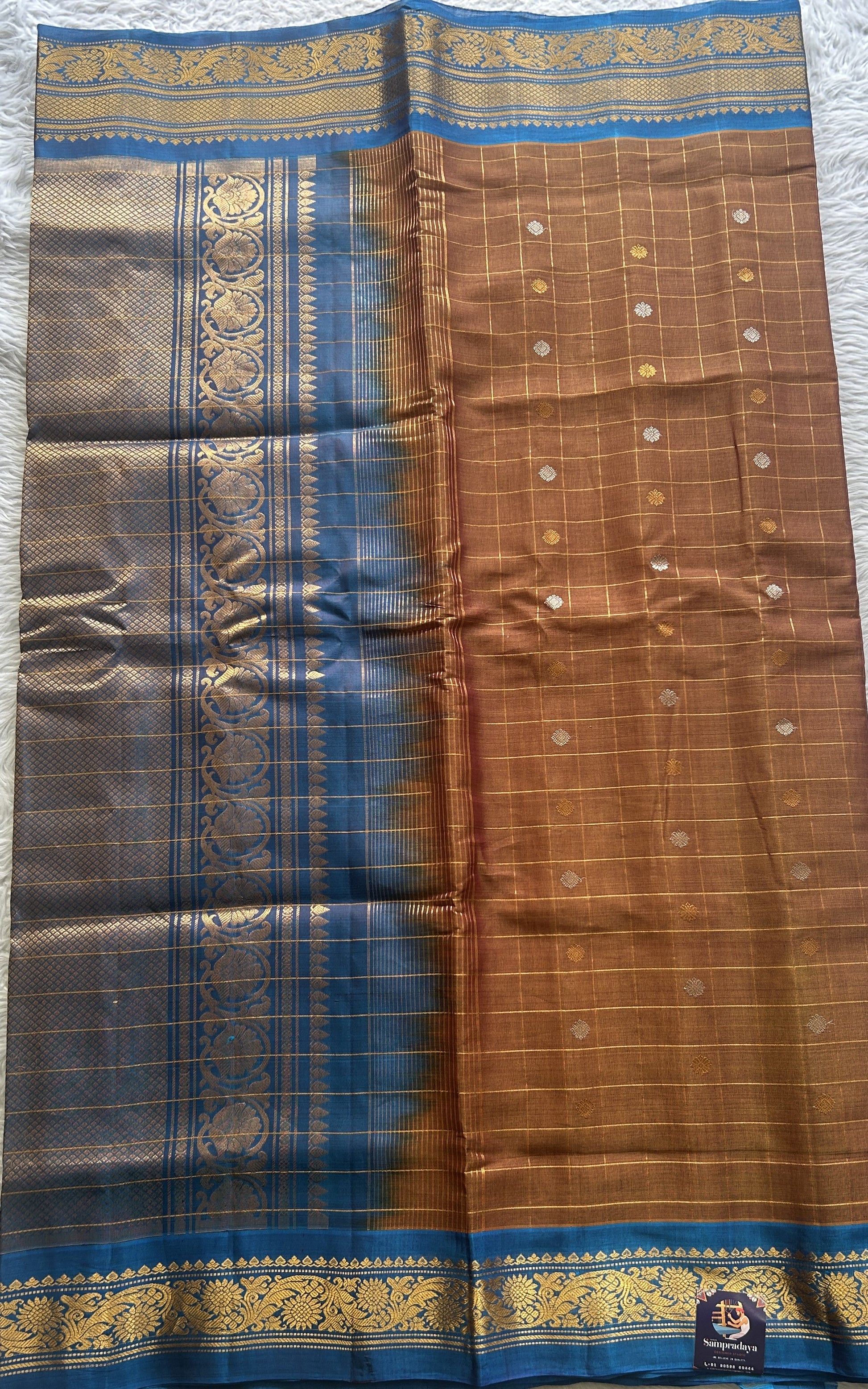 Gadwal Sico Saree Light Brown colored complemented with a Blue Zari Border. - Sampradaya Designer Studio