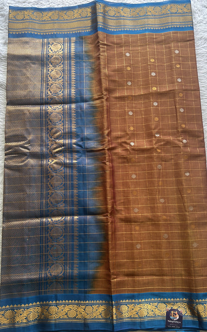 Gadwal Sico Saree Light Brown colored complemented with a Blue Zari Border. - Sampradaya Designer Studio
