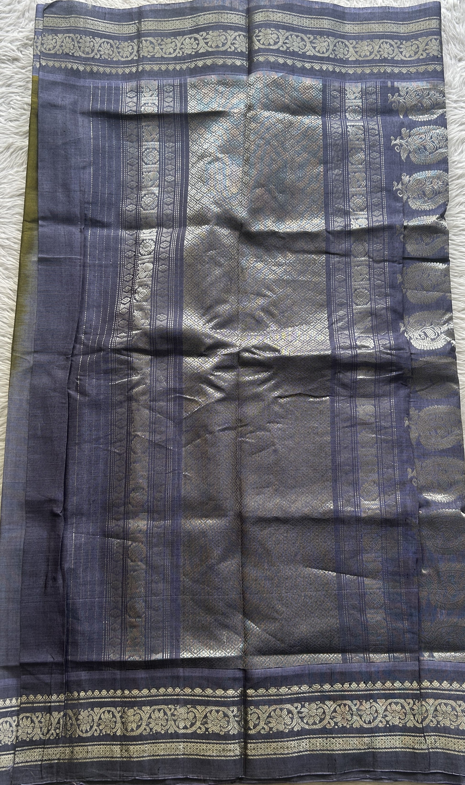 Gadwal Sico Saree Green colored complemented with a Lilac Zari Border. - Sampradaya Designer Studio
