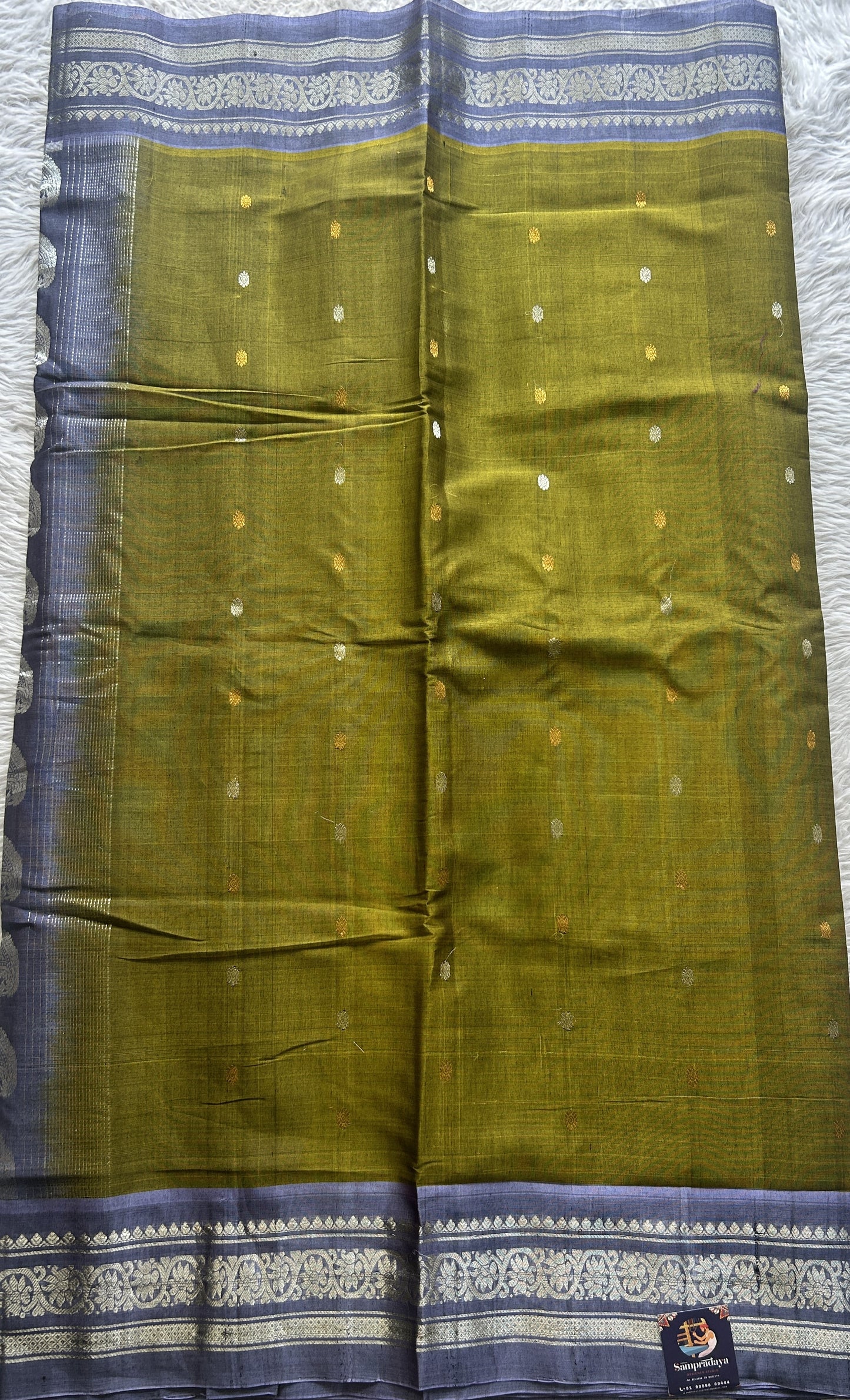 Gadwal Sico Saree Green colored complemented with a Lilac Zari Border. - Sampradaya Designer Studio