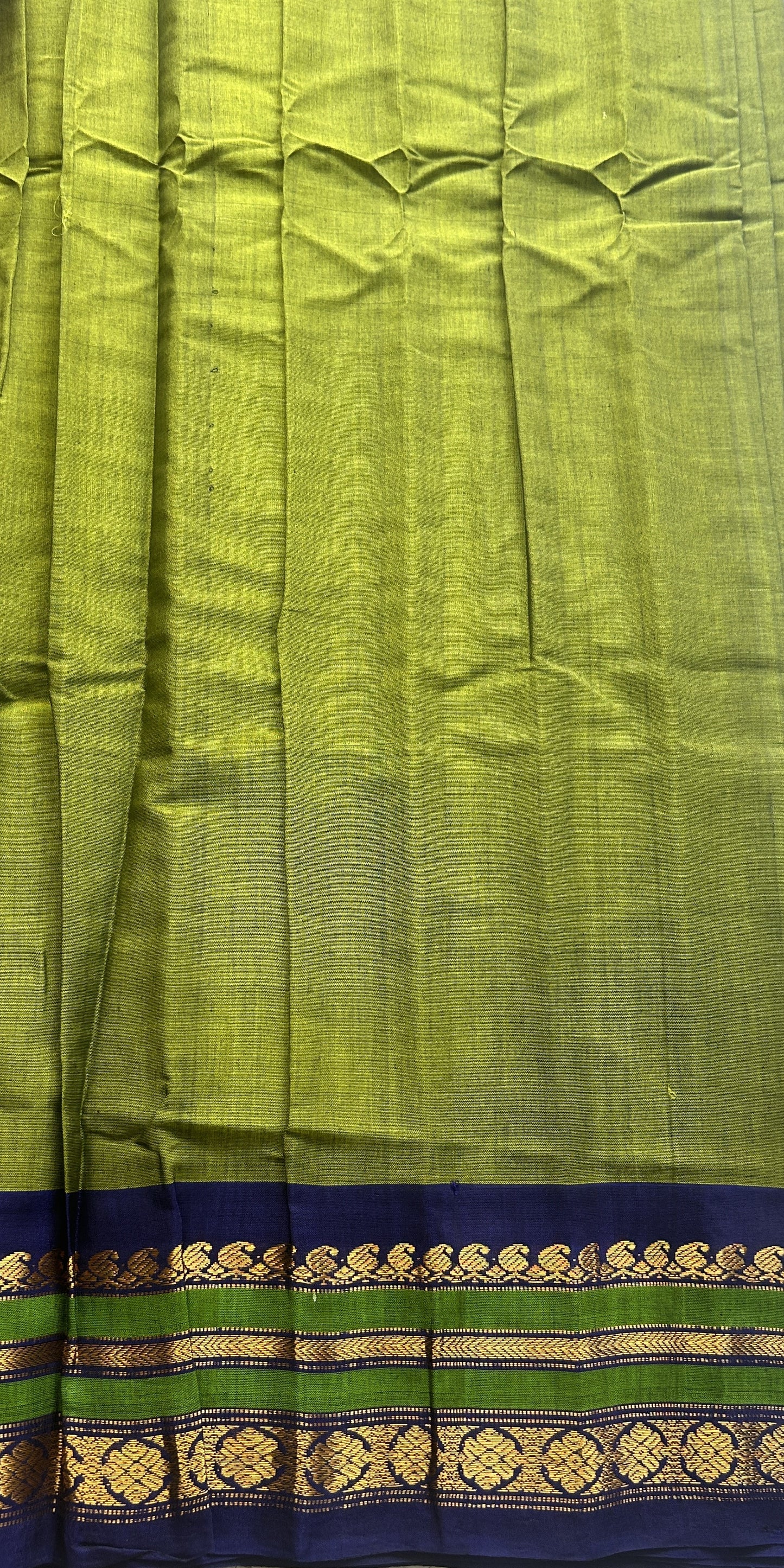 Gadwal Sico Saree Green colored complemented with a Blue Zari Border. - Sampradaya Designer Studio