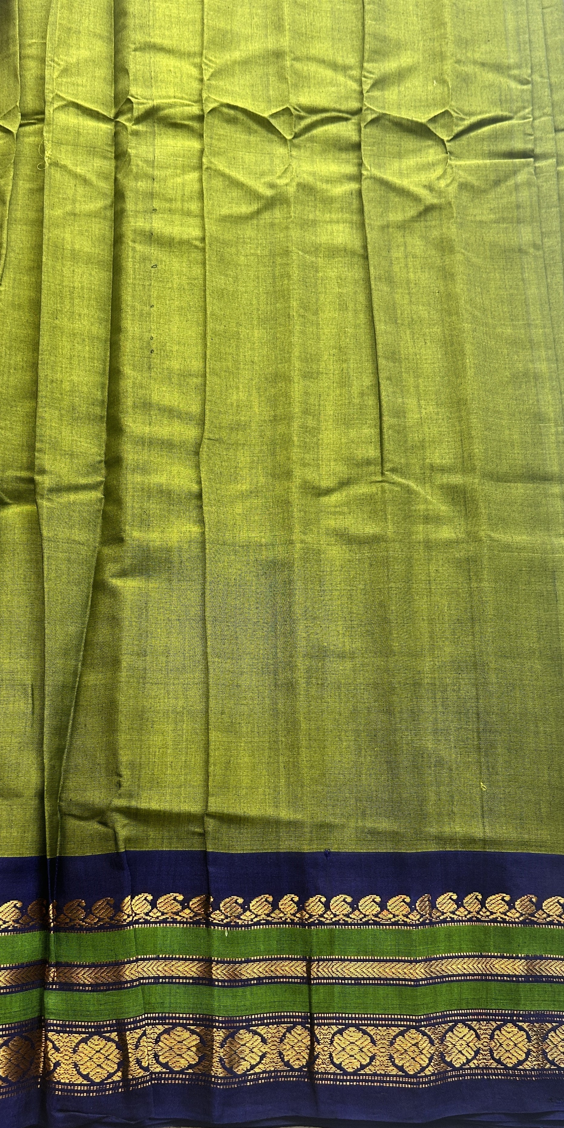 Gadwal Sico Saree Green colored complemented with a Blue Zari Border. - Sampradaya Designer Studio