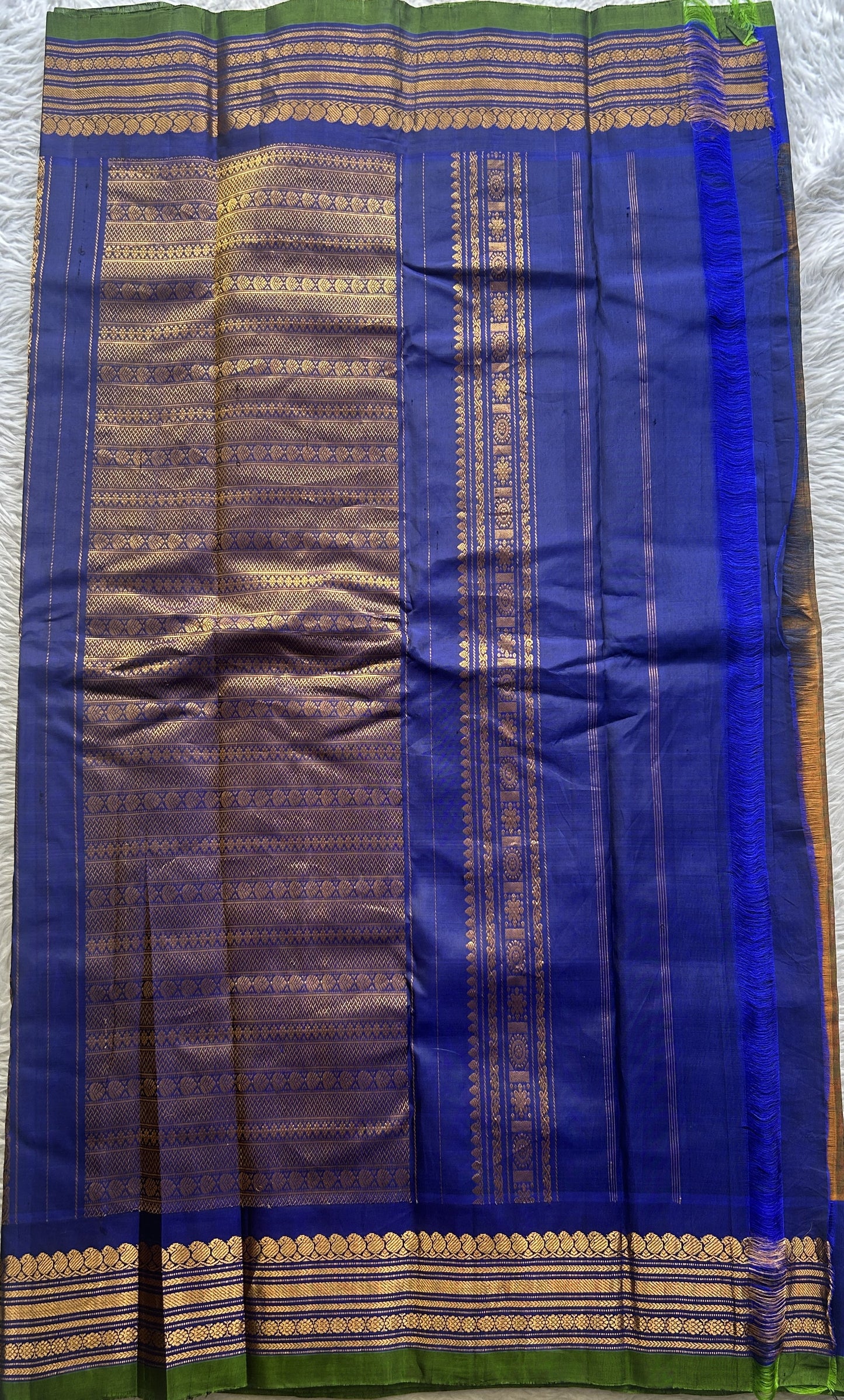 Gadwal Sico Saree Brown colored complemented with a Blue Zari Border. - Sampradaya Designer Studio
