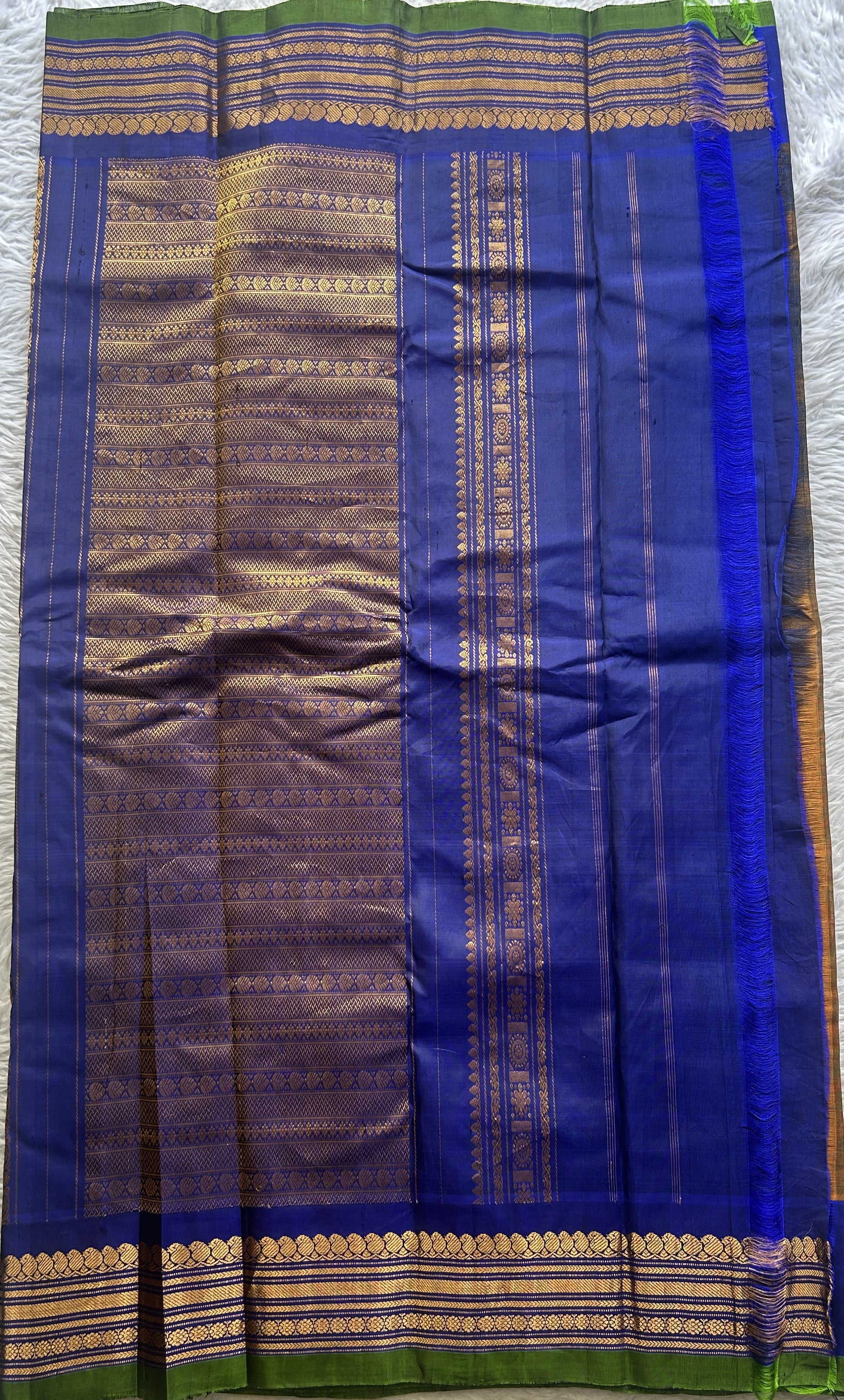 Gadwal Sico Saree Brown colored complemented with a Blue Zari Border. - Sampradaya Designer Studio