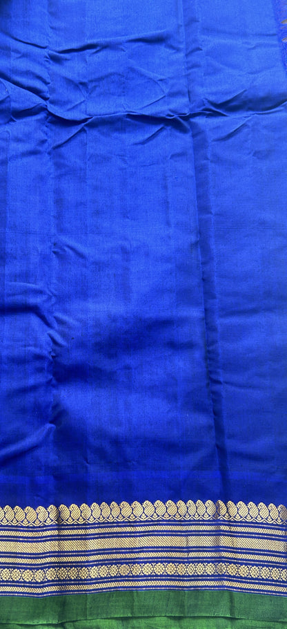 Gadwal Sico Saree Brown colored complemented with a Blue Zari Border. - Sampradaya Designer Studio