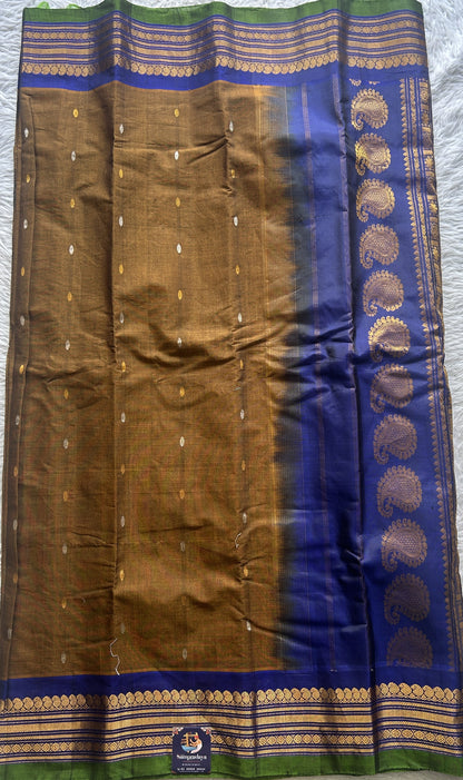 Gadwal Sico Saree Brown colored complemented with a Blue Zari Border. - Sampradaya Designer Studio
