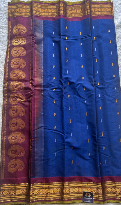 Gadwal Sico Saree Ink Blue colored complemented with a Purple Zari Border. - Sampradaya Designer Studio
