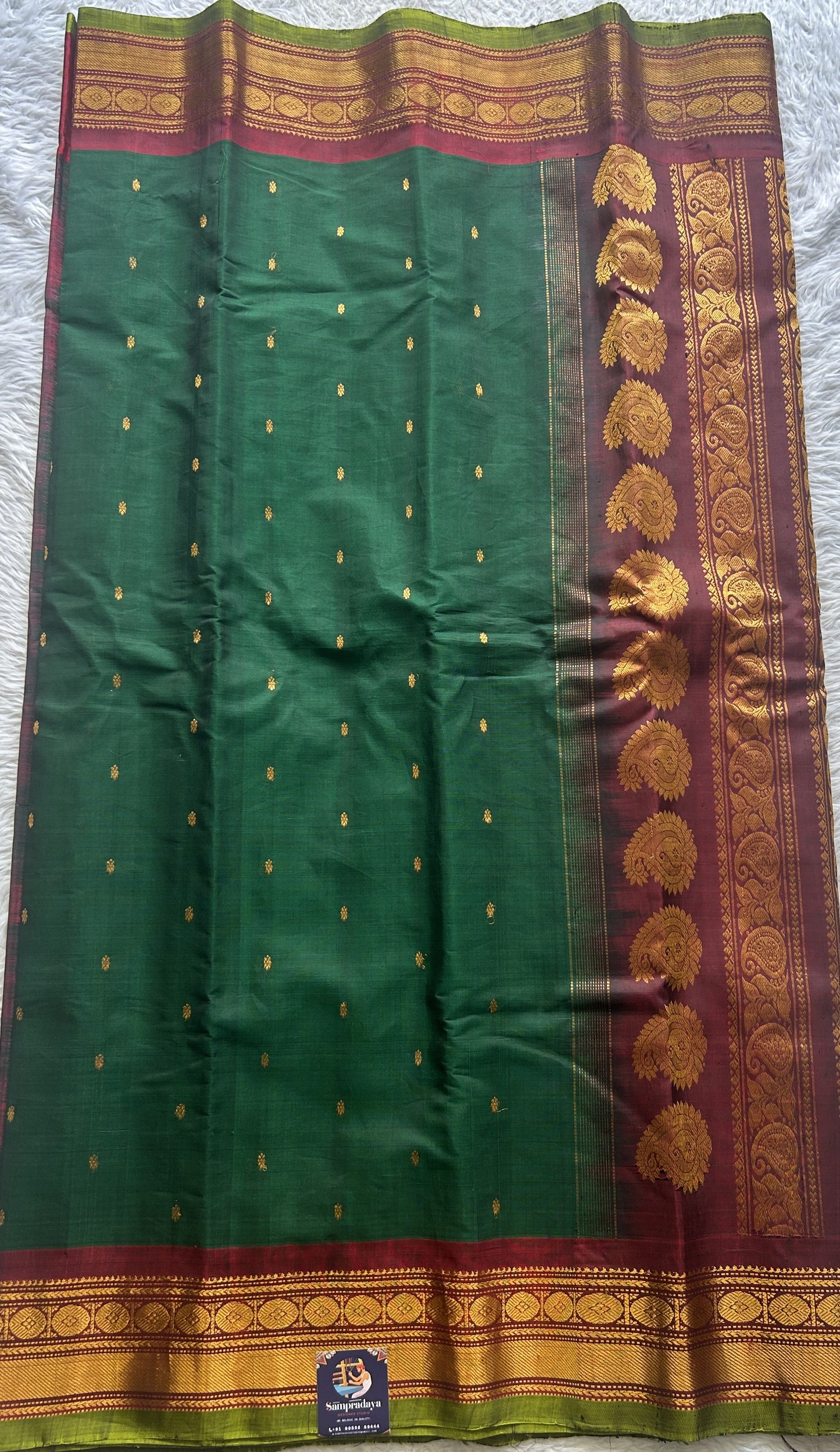 Gadwal Sico Saree Dark Green colored complemented with a Maroon Zari Border. - Sampradaya Designer Studio