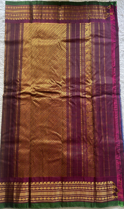 Gadwal Sico Saree Navy Blue colored complemented with a Purple Zari Border. - Sampradaya Designer Studio