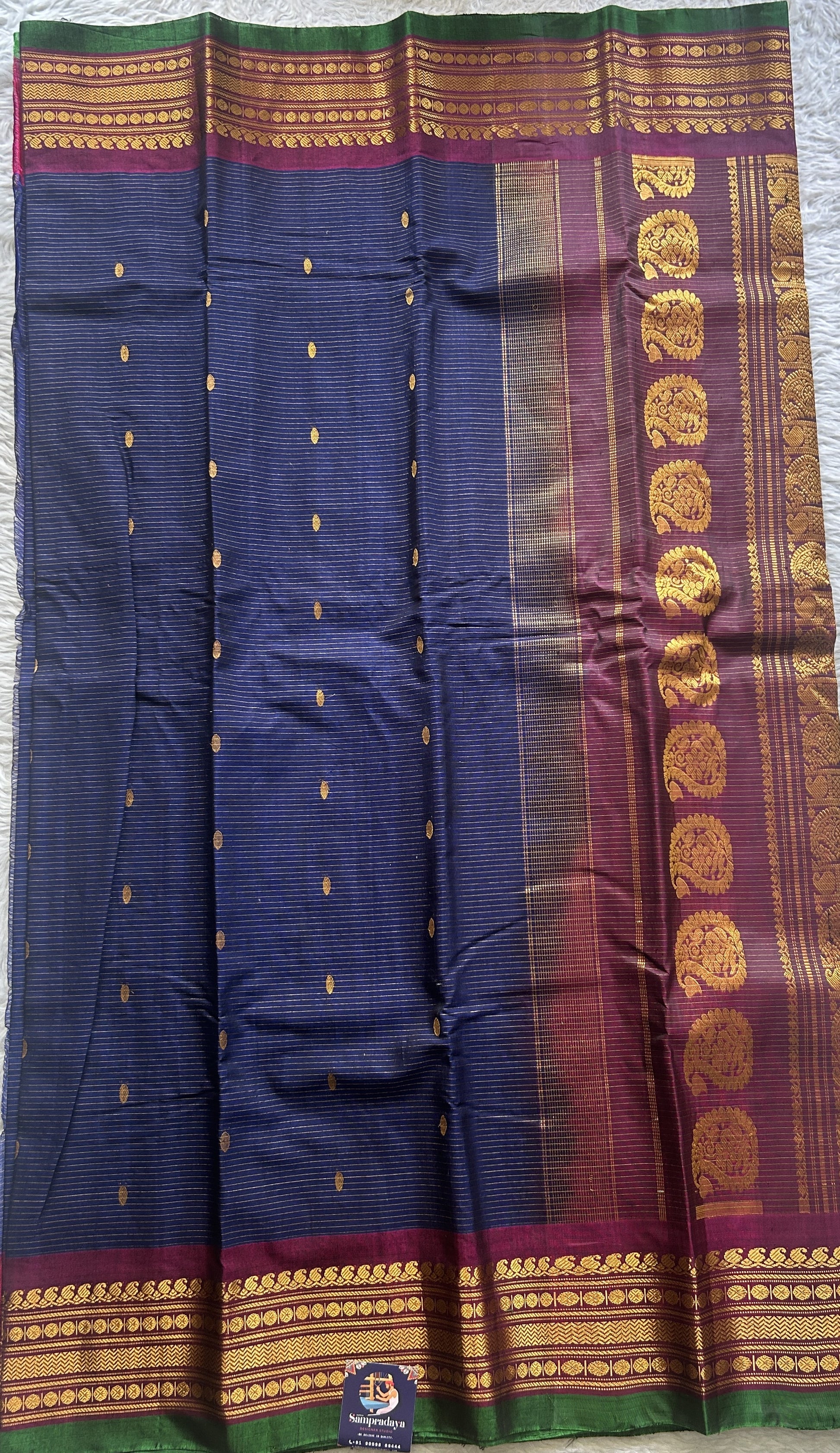 Gadwal Sico Saree Navy Blue colored complemented with a Purple Zari Border. - Sampradaya Designer Studio