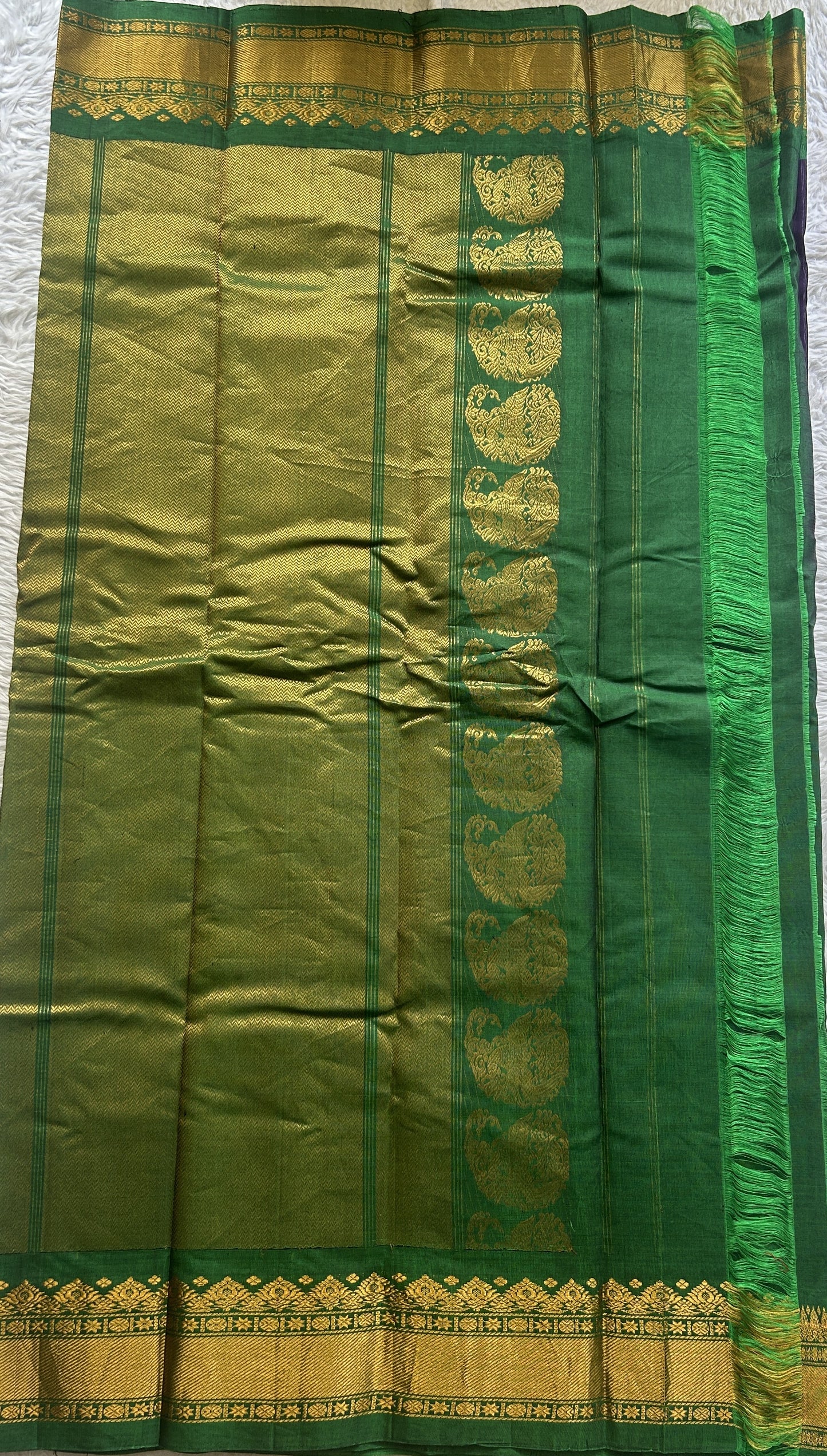 Gadwal Sico Saree Brinjal colored complemented with a Green Zari Border. - Sampradaya Designer Studio