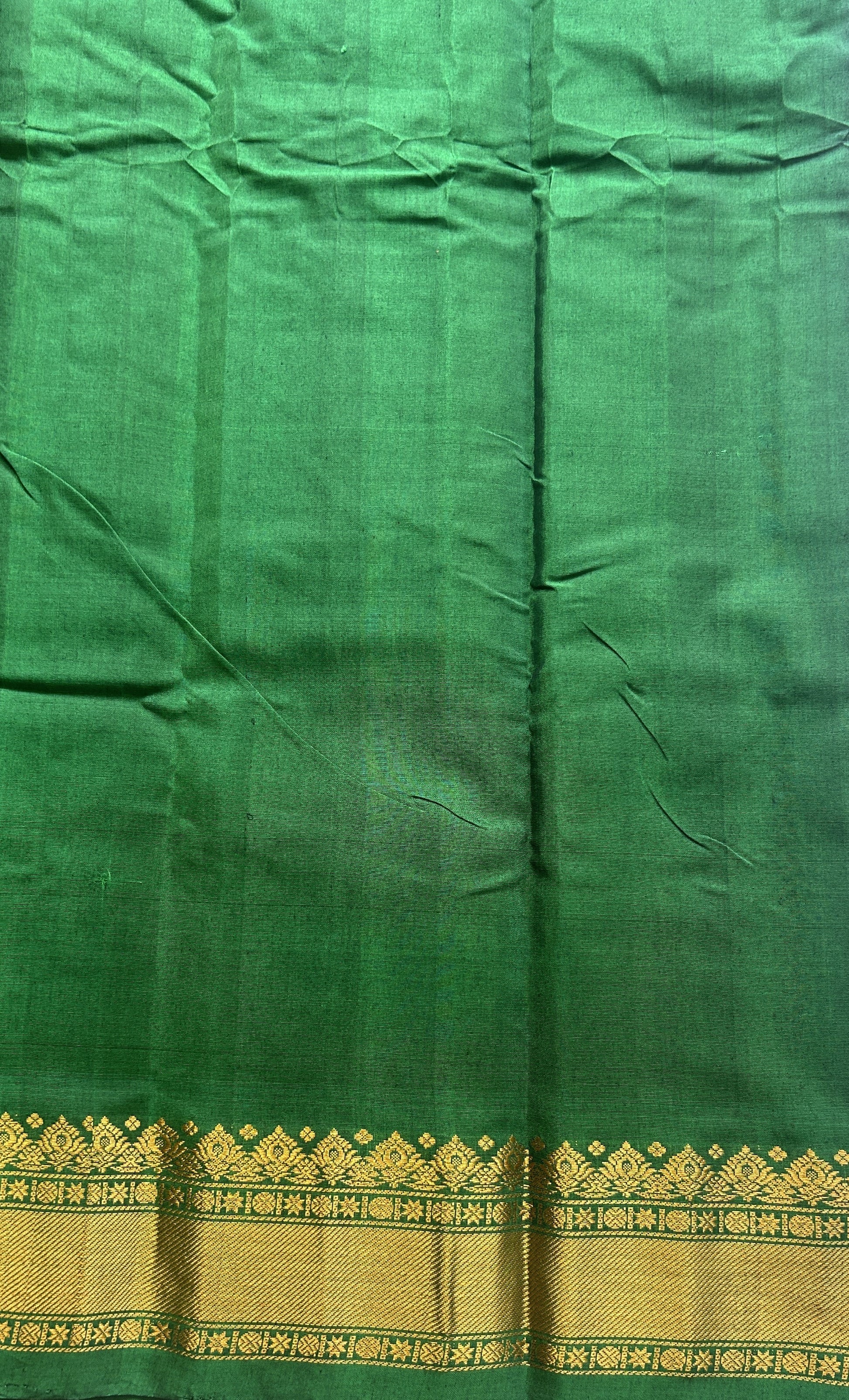 Gadwal Sico Saree Brinjal colored complemented with a Green Zari Border. - Sampradaya Designer Studio