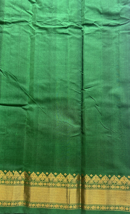 Gadwal Sico Saree Brinjal colored complemented with a Green Zari Border. - Sampradaya Designer Studio