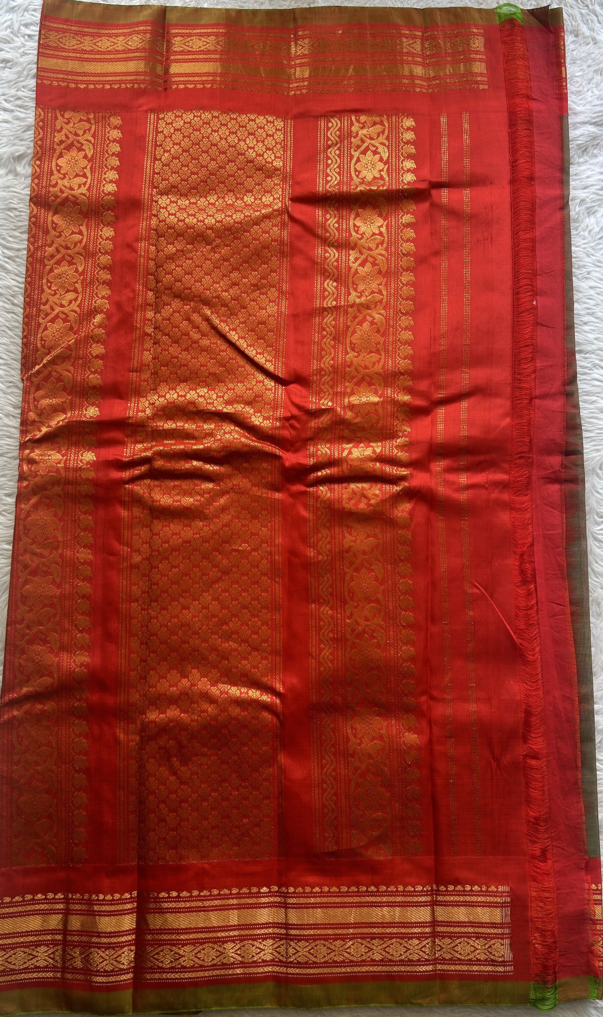 Gadwal Sico Saree Olive Green colored complemented with a Red Zari Border. - Sampradaya Designer Studio