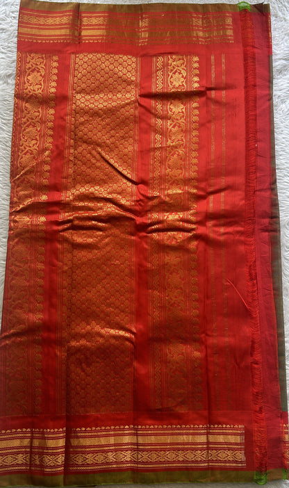 Gadwal Sico Saree Olive Green colored complemented with a Red Zari Border. - Sampradaya Designer Studio