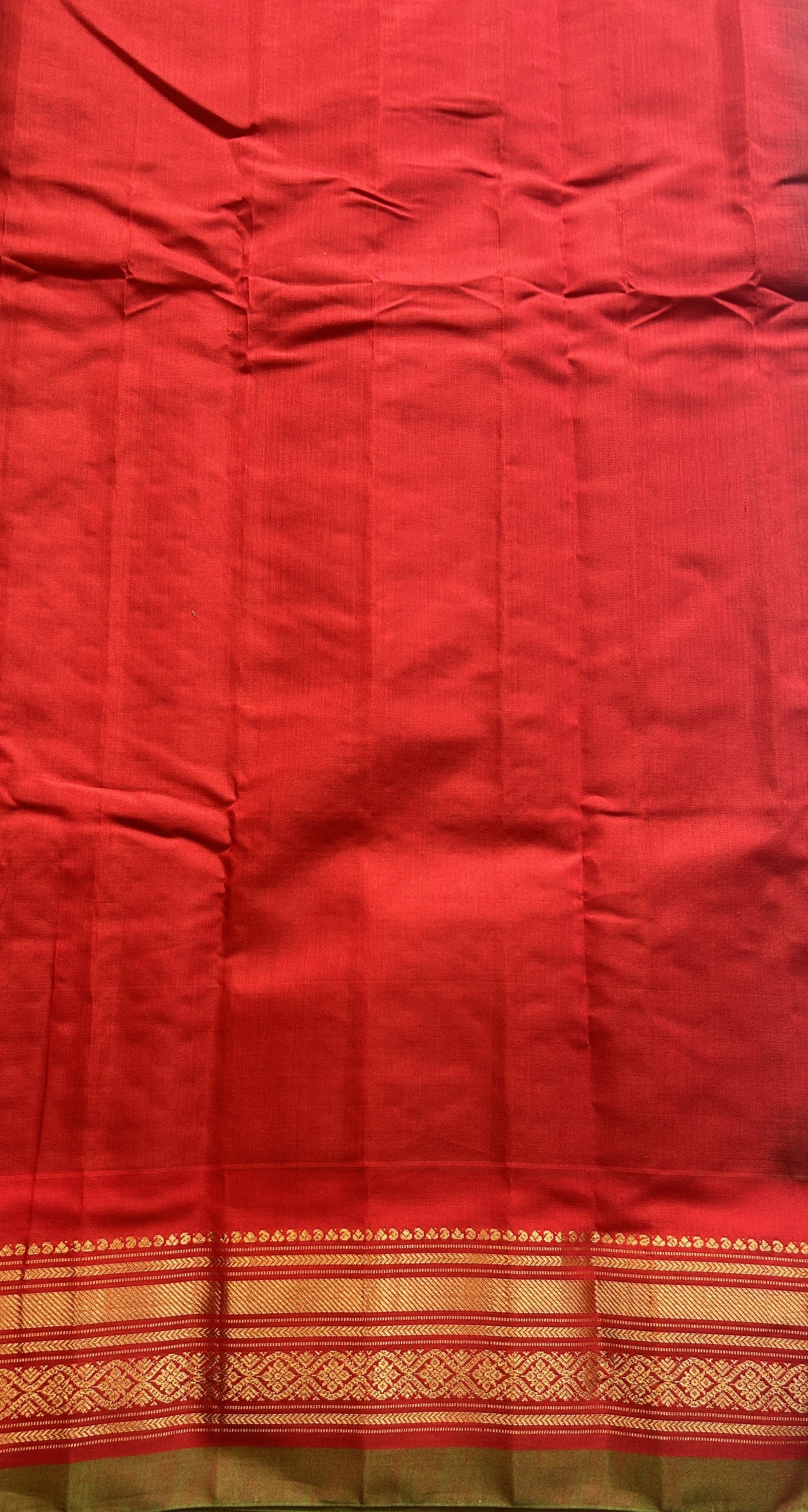 Gadwal Sico Saree Olive Green colored complemented with a Red Zari Border. - Sampradaya Designer Studio