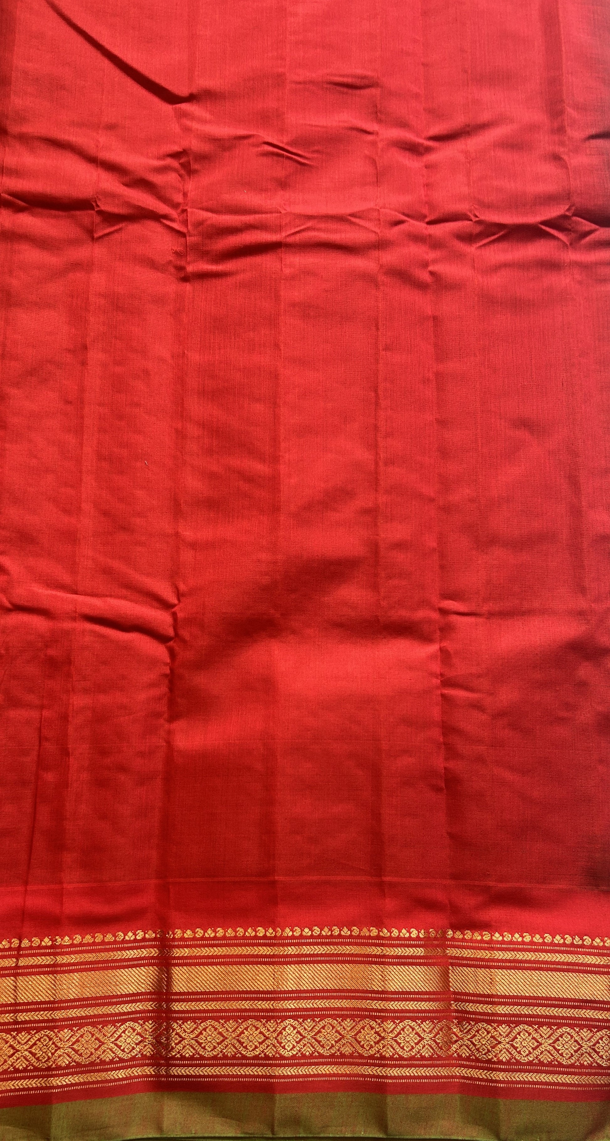 Gadwal Sico Saree Olive Green colored complemented with a Red Zari Border. - Sampradaya Designer Studio