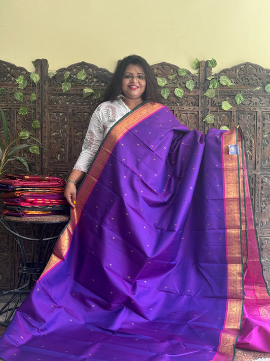 Pure Kanjivaram Silk Saree Violet Colored Complemented with Pink color Border with a Gold Zari Weaving. - Sampradaya Designer Studio