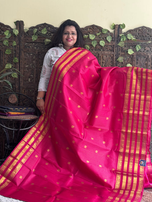 Pure Kanjivaram Silk Saree Dark Pink Colored Complemented with a Gold Zari Border. - Sampradaya Designer Studio
