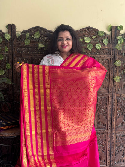 Pure Kanjivaram Silk Saree Dark Pink Colored Complemented with a Gold Zari Border. - Sampradaya Designer Studio