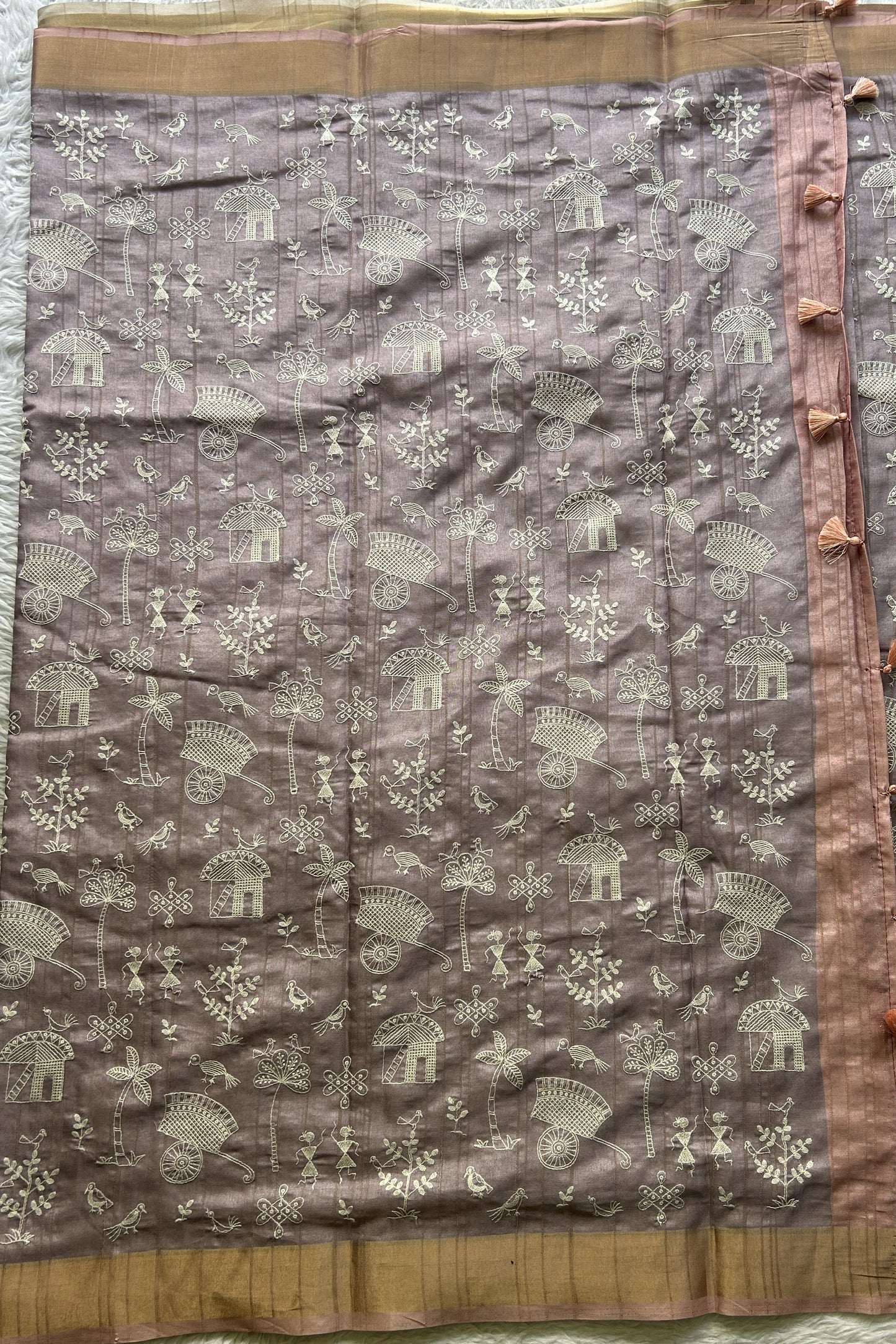 Semi Tussar Saree Light Lavender Colored complemented with a Peach Zari Border. - Sampradaya Designer Studio