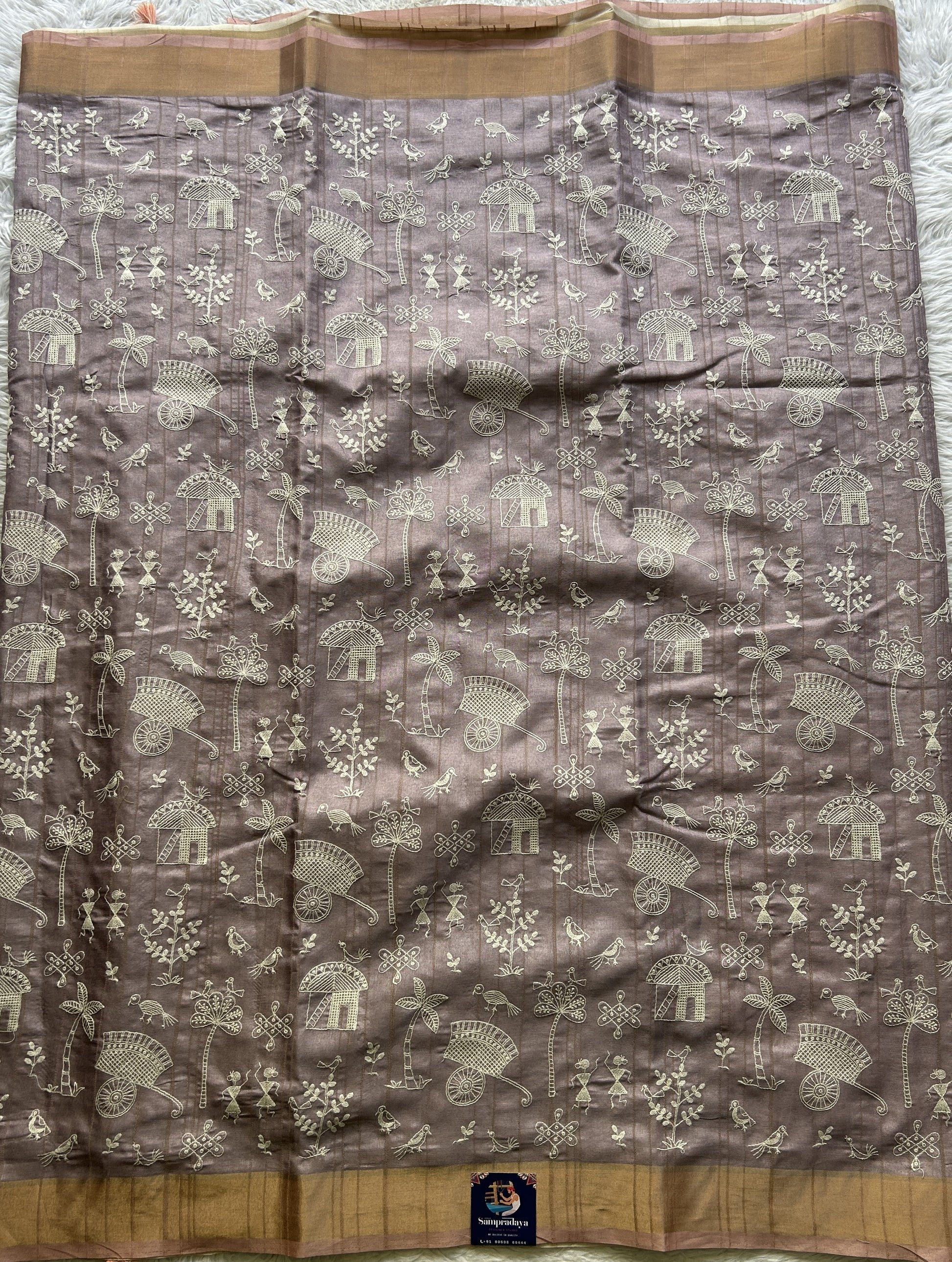 Semi Tussar Saree Light Lavender Colored complemented with a Peach Zari Border. - Sampradaya Designer Studio