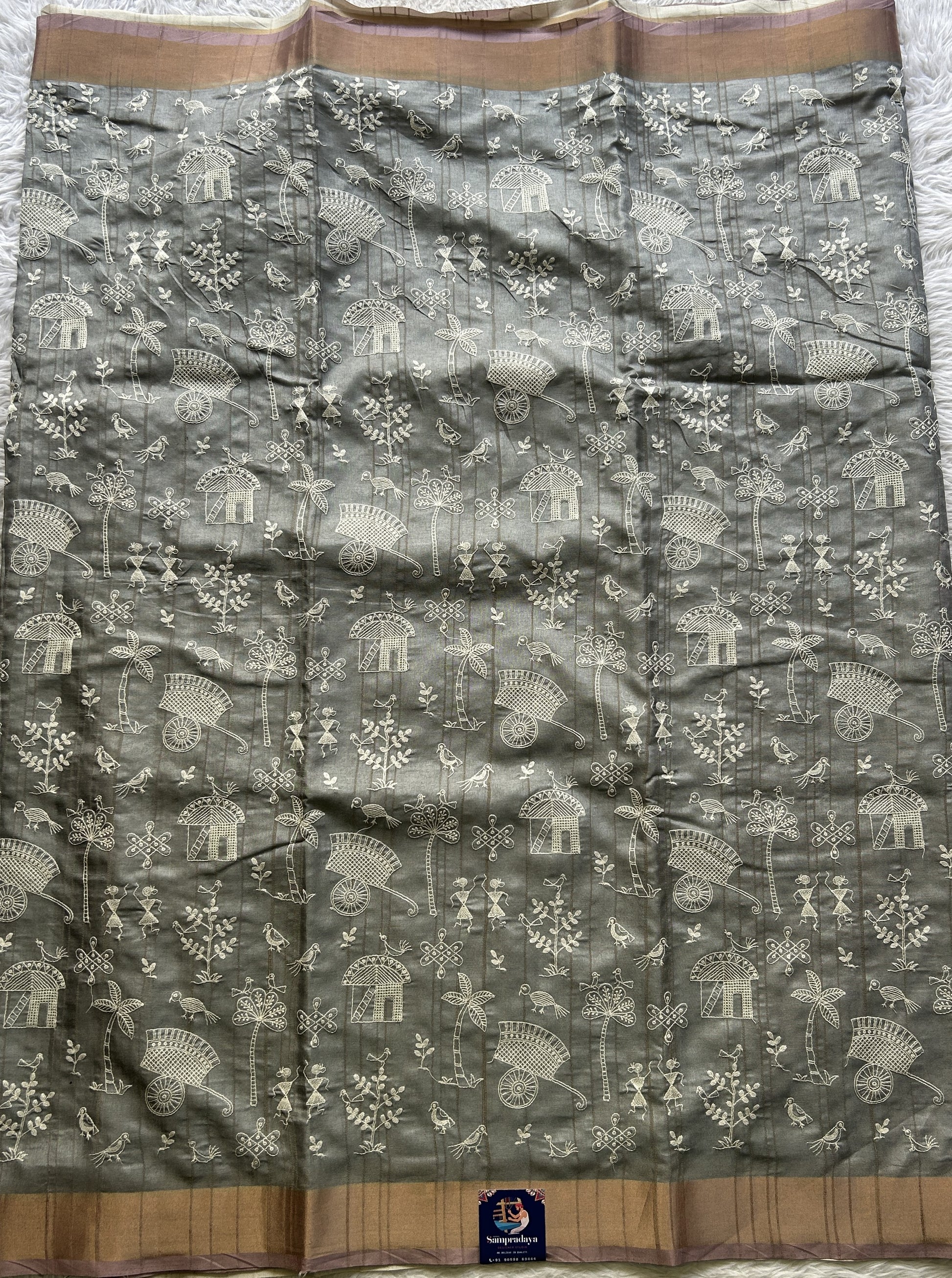 Semi Tussar Saree Gray Colored complemented with a Light Pink Zari Border. - Sampradaya Designer Studio